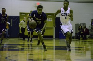 Alex Hunter (left) leads the fast break against Millbrook. The freshman surprised many with his play.