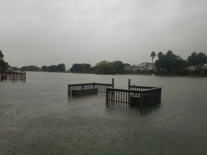 The lake in Thai’s neighborhood affected by 40 inches of rain. Usually, these decks are used to harbor small boats and kayaks. Many of these boats were swept away because of the flooding. (Photos used by permission of Kelly Thai) 