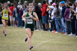 Comesky competed in the NCHSAA 4A Mideast regional meet. She helped her team qualify for States by running a strong race. Photo used by permission of Dan Loughlin.