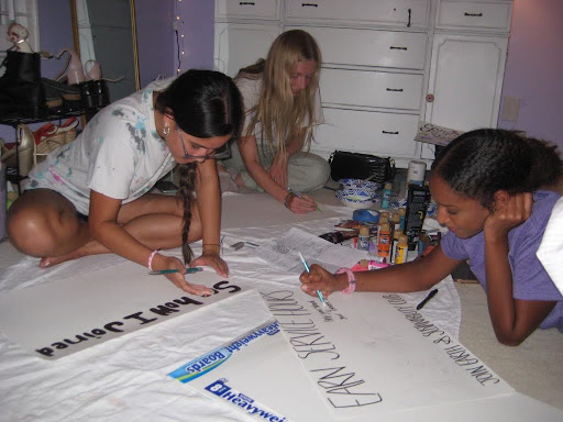 Pictured left to right, Alexis Cook, Clara Davis, and Ruth Metaferia, making posters for Earth and Sustainability Club. You can find these posters hanging in every stairwell in the main and Murphy buildings. (Photo used by permission of Katie Carrigan)